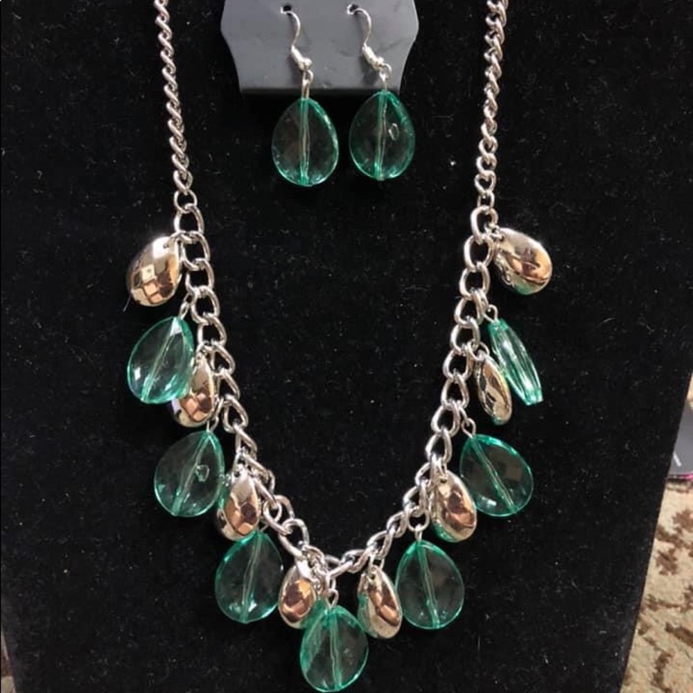 Green and silver jewelry set.
